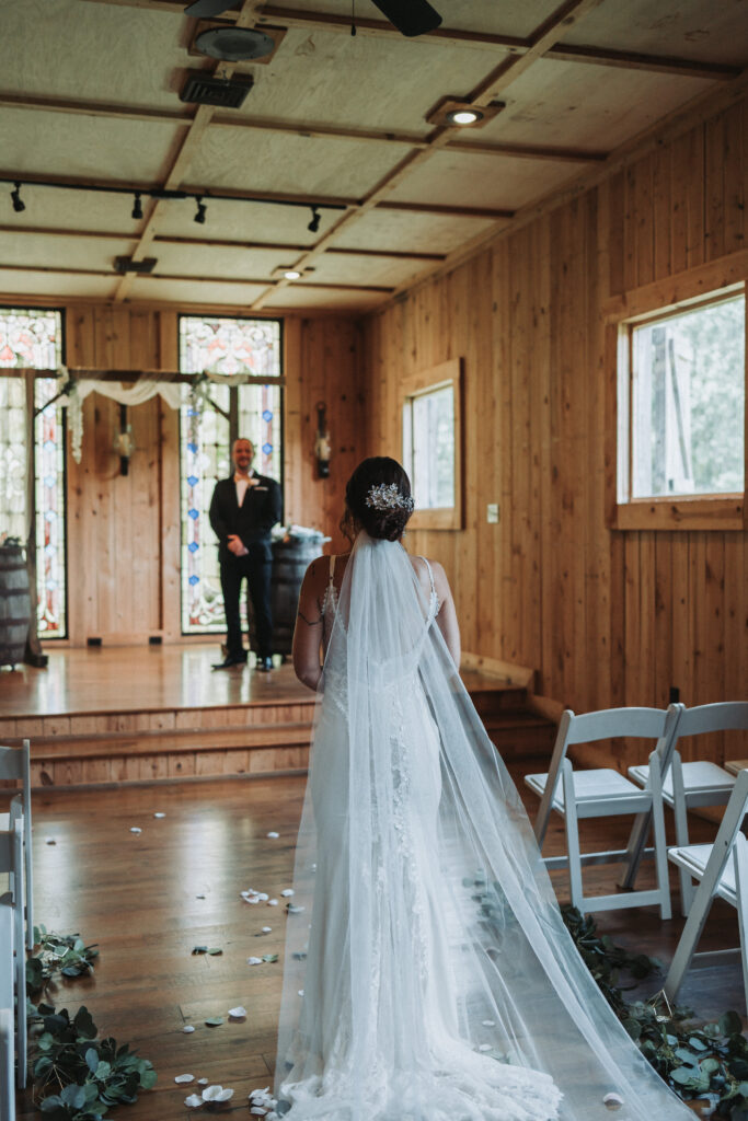 Bride walking up the aisle during the beginning of ceremony- Quinn Photography LLC