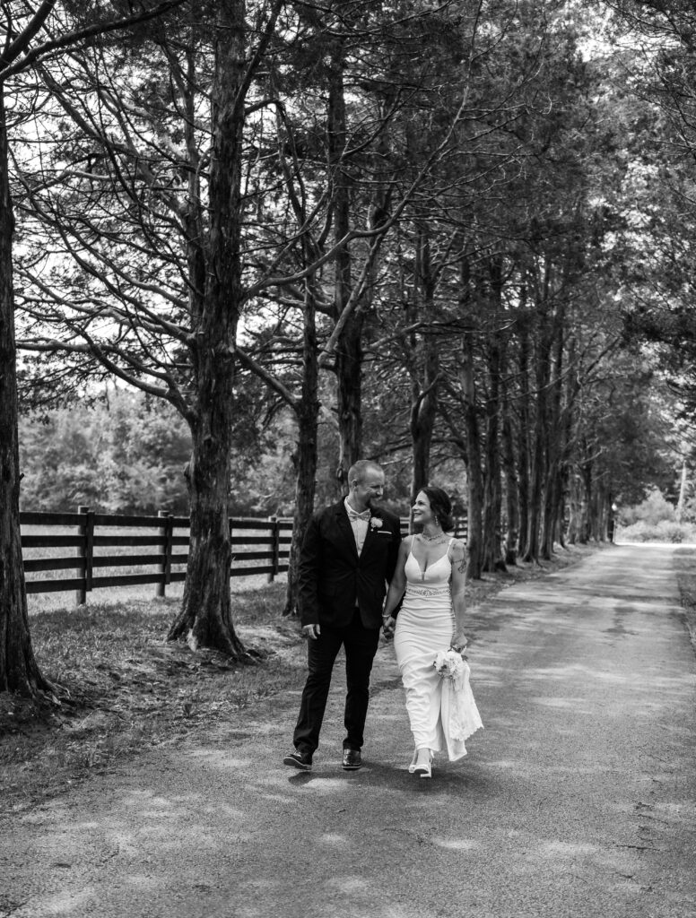 Bride and groom taking a stroll at the Gentry Farm in Danville Virginia- Quinn Photography LLC