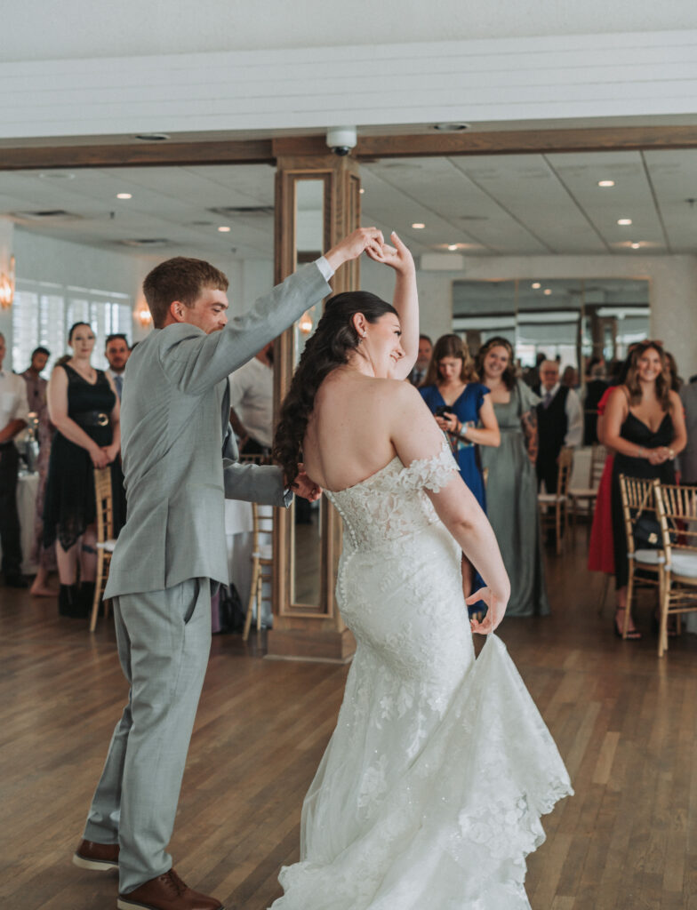 Groom spinning the bride on the dance floor at Lesner Inn