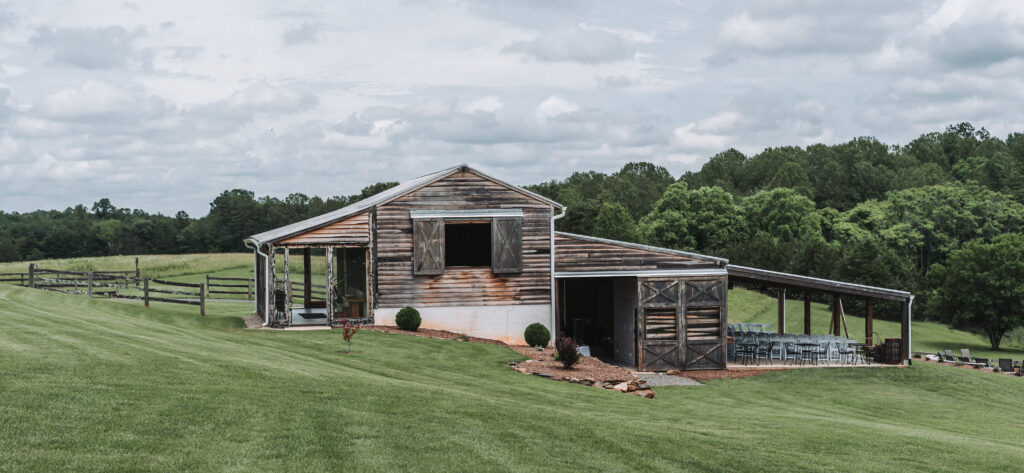 Wide shot of the rustic barn at Due Sorelle wedding venue in Ruckersville, Virginia