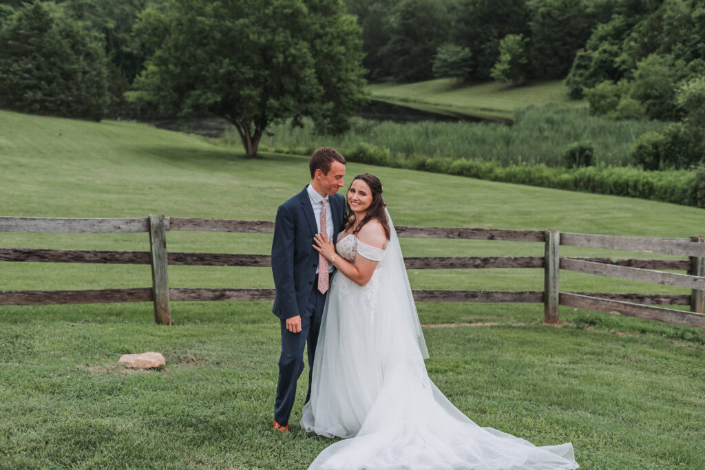 engagement and wedding photo storage process 
bride and groom wedding photo smiling in a field
how wedding and engagement photos are protected